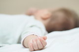 Hand of newborn 4-month baby