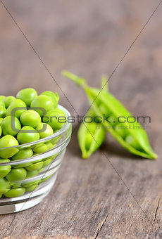 Green peas in a glass bowl