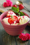 Ice cream with strawberries and mint.