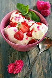 Cup with ice cream and strawberries.