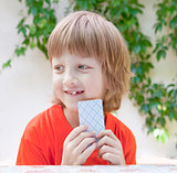 Boy with Blond Hair Playing Cards 