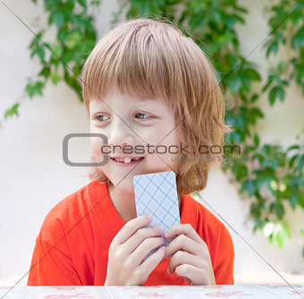 Boy with Blond Hair Playing Cards 