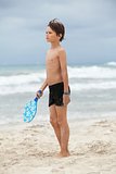 happy little child kid boy  playing beachball on beach in summer 