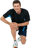 adult attractive man in sportswear knee pain injury ache isolated