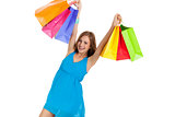 attractive young woman with colorful shopping bags isolated