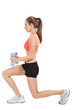 young attractive woman stretching legs after jogging isolated
