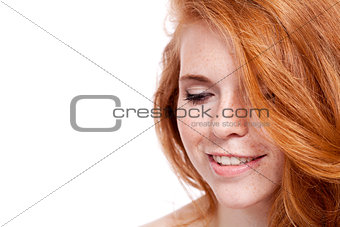 beautiful young redhead woman with freckles portrait