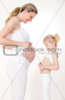 little girl with her pregnant mother