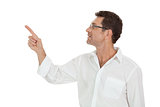 adult attractive smiling man pointing his finger on the copyspace