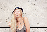 happy young blonde woman with hat outdoor summertime