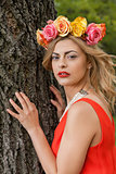 beautiful woman portrait outdoor with colorful flowers
