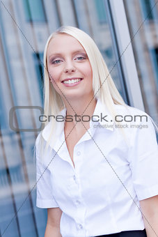 attractive young successful smiling business woman standing outdoor 