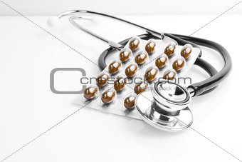 a medical pills blister near stethoscope