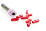 test tube near red pills
