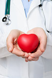 Doctor protecting a heart