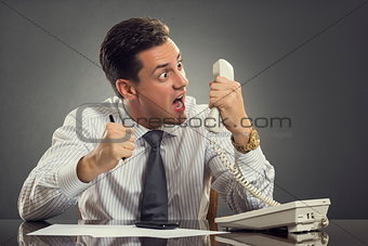 Furious businessman shouting on phone