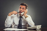 Thoughtful businessman on phone
