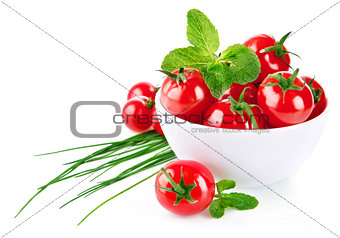 Fresh tomato in plate with green leaf