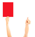 Hand of referee with big red card and point the direction