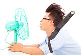 Summer heat, business man use fans to cool down