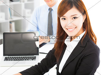 pretty professional young woman with colleague in office