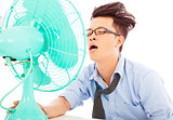 young business man use fans to cool down