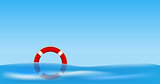 Red life buoy floating on water