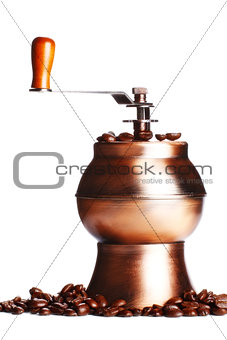 vintage coffee grinder standing on beans
