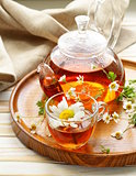 Organic herbal green tea with fresh chamomile flowers