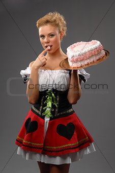 Pretty housewife with a big cake