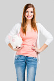 Blonde woman with a piggy bank