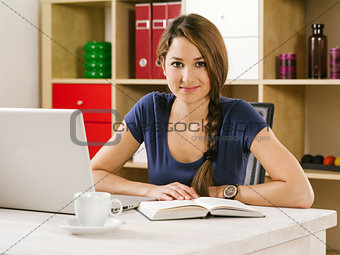 Student studying in front of laptop