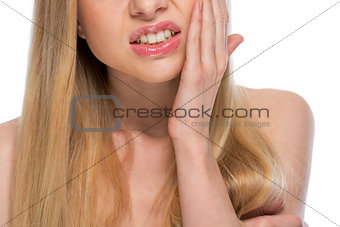 Closeup on teenager with toothache