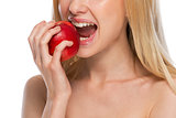 Closeup on teenager eating apple