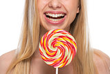 Closeup on happy teenager with lollypop