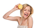 Portrait of happy teenager with lemon