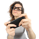 Geek woman playing with a smart phone