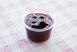 Cup of delicious blueberry sauce