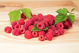 Raspberry berries on wooden background