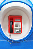 Red pay-phone on wall