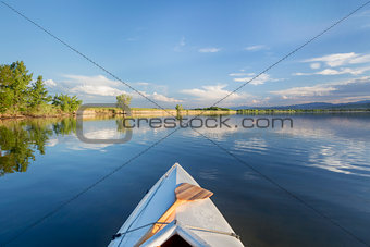summer canoe paddling on lake