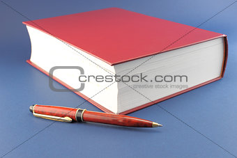 Pen and red book