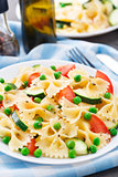 Pasta with zucchini, tomatoes and peas
