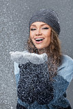 Cute girl with snowflakes having a good time