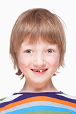 Portrait of a Boy with Milk Teeth Smiling  