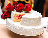 Wedding cake decorated with red roses