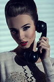 woman talking on vintage phone