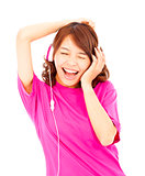 asian woman listening and enjoying music in headphones