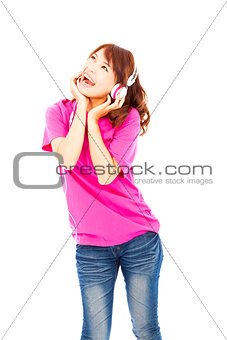 young woman listening to music and looking up 
