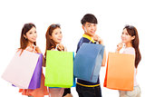 happy young people with shopping bags